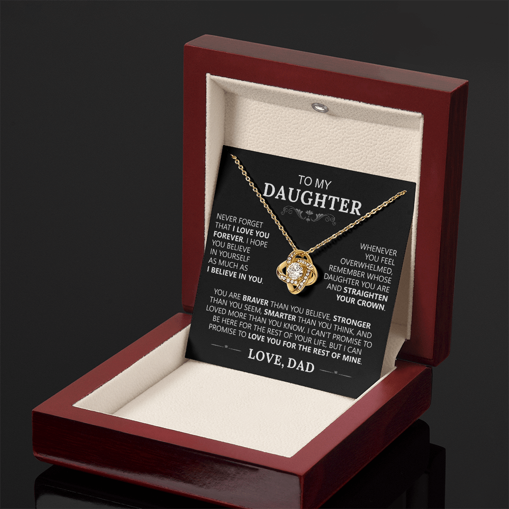 The To My Daughter - Love Knot Necklace is shown in an open red jewelry box, featuring a loving message from Dad inside the lid that celebrates an unbreakable bond—making it the perfect father-daughter gift.