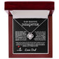 Elegant silver love knot necklace with a sparkling crystal, displayed in a black gift box featuring a heartfelt message from a father to his daughter.