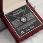 Silver love knot necklace with a sparkling crystal, presented in a gift box with a heartfelt message from a mother to her daughter