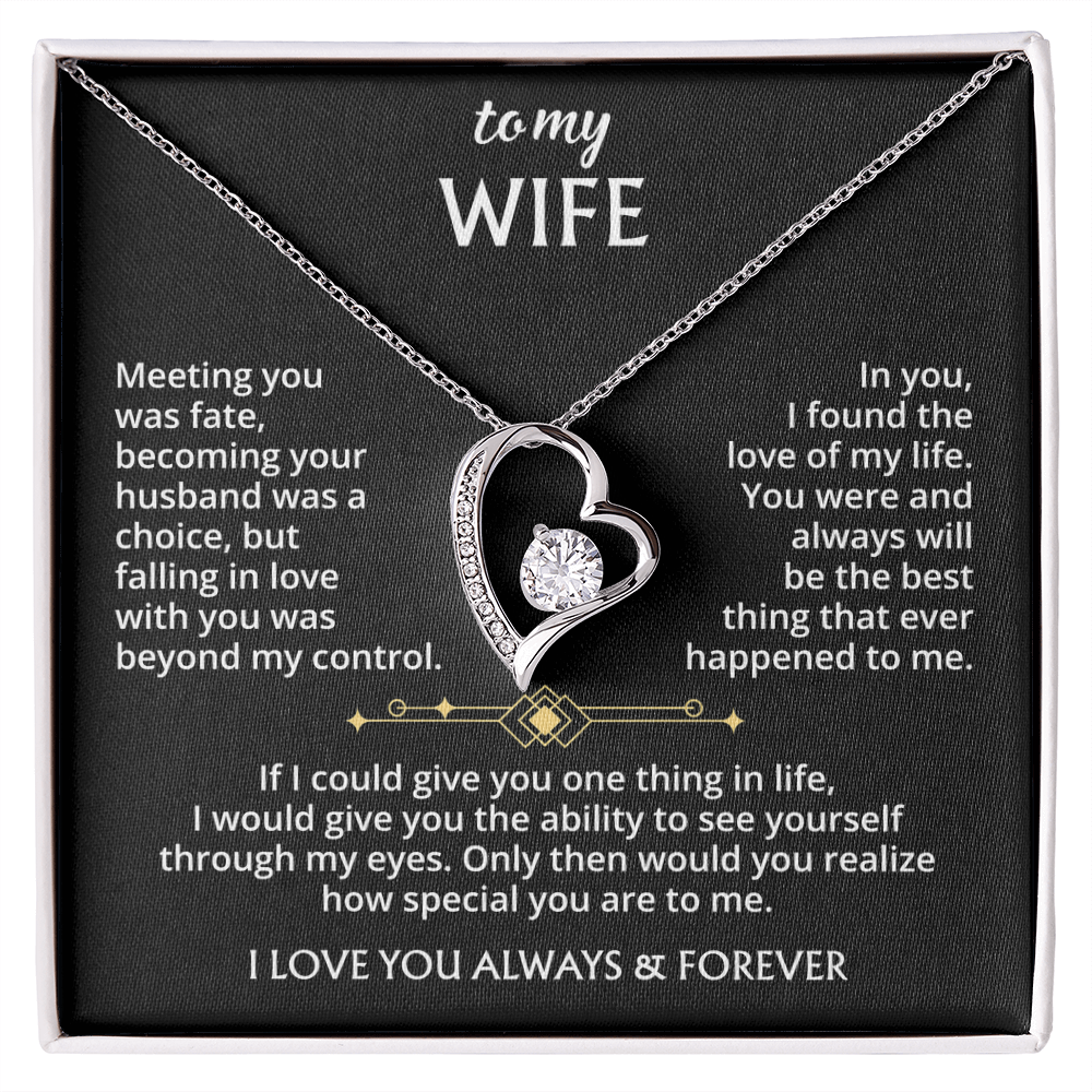 The To My Wife – Forever Love Necklace with Message of Fate and Devotion features a silver heart-shaped pendant with a dazzling crystal, displayed in a gift box. The lid includes a touching message—perfect as an anniversary gift for your wife.