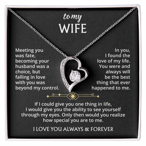 The To My Wife – Forever Love Necklace with Message of Fate and Devotion features a silver heart-shaped pendant with a dazzling crystal, displayed in a gift box. The lid includes a touching message—perfect as an anniversary gift for your wife.