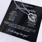 The To My Beautiful Granddaughter - Forever Love Necklace with Heartfelt Message Card features a silver heart-shaped pendant adorned with a central cubic zirconia, presented on a card conveying love and cherished sentiments from a grandparent.