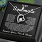 Silver heart pendant necklace with a sparkling crystal, displayed in a wooden gift box with a romantic message for a soulmate, surrounded by rose petals.