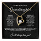 The To My Beautiful Granddaughter - Forever Love Necklace features a gold heart with a cubic zirconia center on black velvet, accompanied by a heartfelt message card expressing enduring love and support.