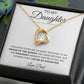 The To My Daughter: Forever Connected Message Card & Love Knot Necklace Set features a gold heart-shaped pendant with a clear cubic zirconia, beautifully displayed in a gift box with a heartfelt message from Dad.