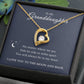 The To My Granddaughter - Forever Love Necklace, a stunning gold heart-shaped piece with a diamond centerpiece, shines in an open black box. The accompanying card reads, You will always be in my heart. I love you to the moon and back.